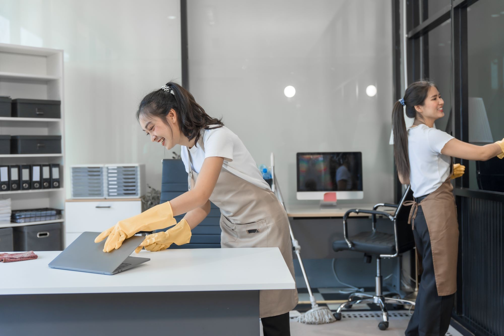 Two asian housekeepers wear overalls and work toge 2025 02 15 16 08 55 utc